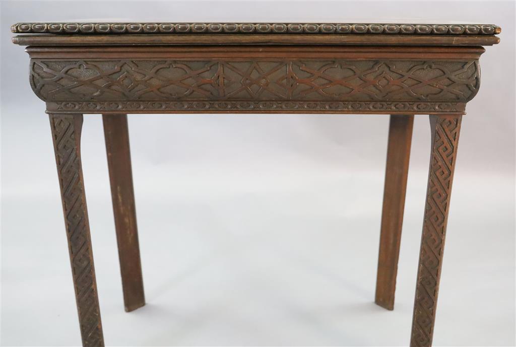 A George III mahogany card table, W.2ft 5in. D.1ft 3in. H.2ft 4in.